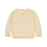 A cream-colored knit sweater shown from the back, featuring a buttoned henley neckline with two wooden buttons and ruffled cuffs, set against a plain white background.
